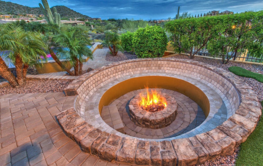 Amazing mountain views and homey firepit in this East Mesa home's backyard.